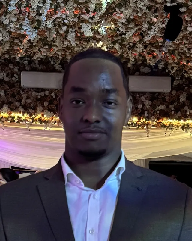 Abdikarim Sharif, Birmingham web designer, in a dark suit and white shirt